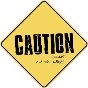   CAUTION  HELMS ON THE WAY  CROSSING SIGN