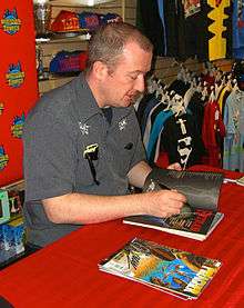 Ennis signing copies of Hitman and Preacher at an April 19, 2012 