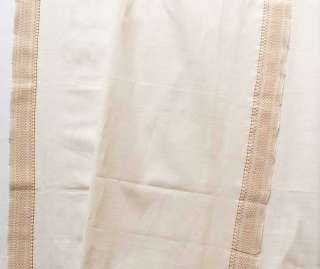 hand loomed, cotton fabric with contrasting borders along 
