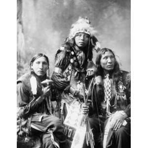 c1899 photo Three young Indian men, probably Sioux, wearing native 