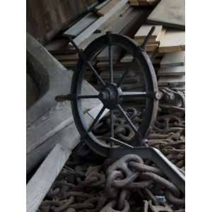  Old Ships Wheel, Chains and Wood Planks against a Cedar 