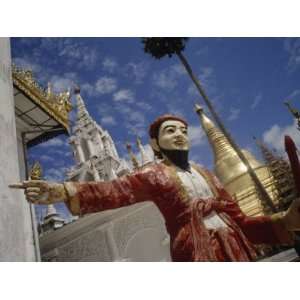  Painted Statue and the Gilded Shwedagon Stupa on the Right 