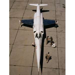  Mechanics Work on an Experimental X 3 Aircraft on a Runway 