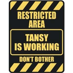   RESTRICTED AREA TANSY IS WORKING  PARKING SIGN