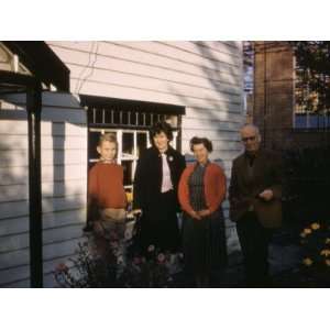 Four People Pose for their Photo Outside a House in Essex Photographic 