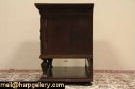 Hand carved about 1910 of oak with rosewood panels, this sideboard or 