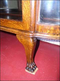   Antique Oak China Cario Cabinet Claw Feet Has original curved glass