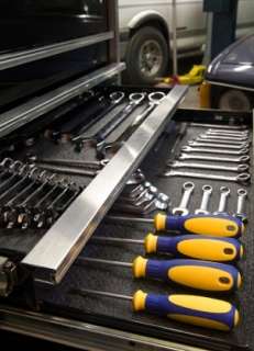Auto tools organized in a garage tool cabinet