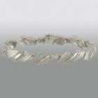 channel set diamonds this sterling silver bracelet features gracefully 