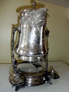 ANTIQUE SILVER PLATE TILTING ICE WATER PITCHER PRESENTED TO FLORA 