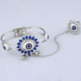   light blue devils eyes two small bells open bracelet link unique ring