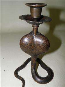 We are pleased to offer this brass Indian cobra candle holder. This 