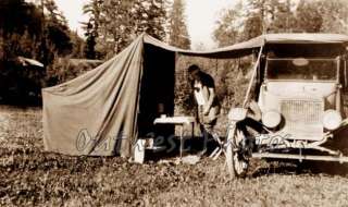 PHOTO OF A 1920S FLAPPER GIRL CAMPING IN HER TENT  