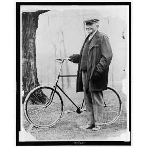  John Davison Rockefeller,1839 1937,standing with a bicycle 