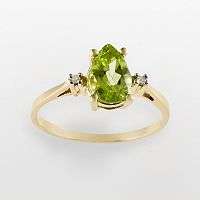 From the heart. Dazzling diamonds and a peridot stone make this 