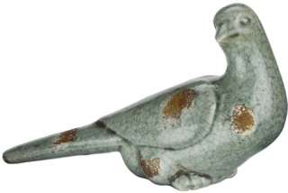   ceramic pigeon statues make a great addition to a garden or patio