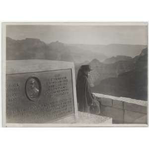   Powell seated at edge of monument to Major John Wesley Powell. 1918
